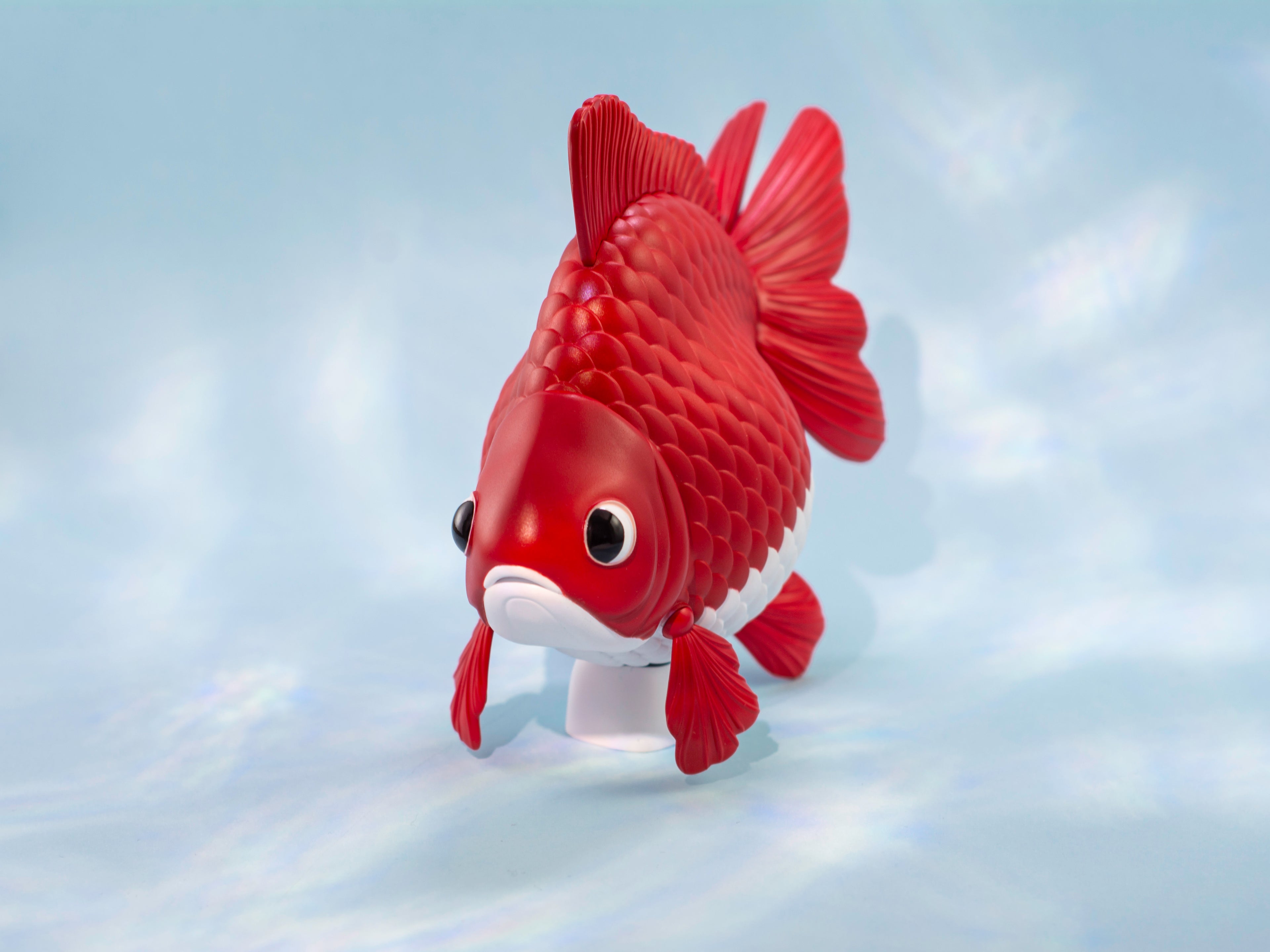Ryukin Goldfish-shaped toy on a light blue background